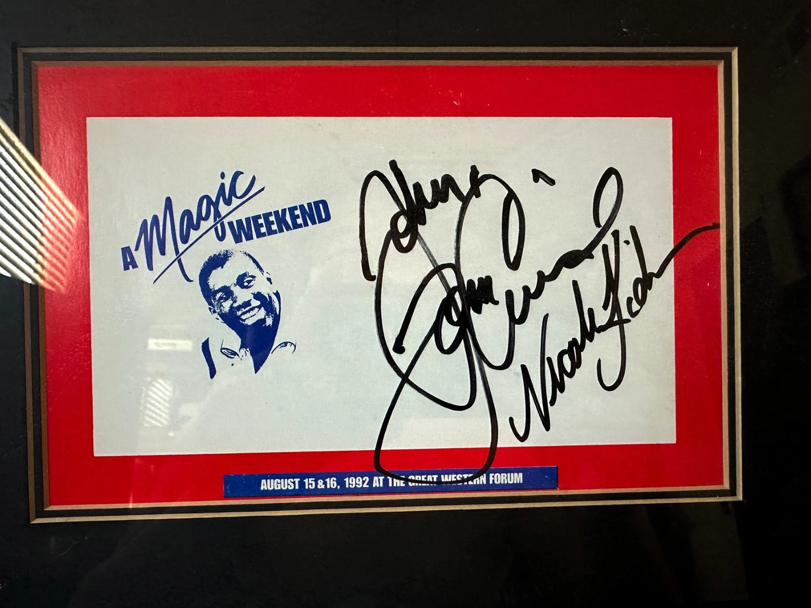 A framed “A Magic Weekend” programme cover dated August 15 and 16, 1992 at the Great Western Forum, signed in heavy black marker by Tom Cruise and, beneath him, Nicole Kidman.
